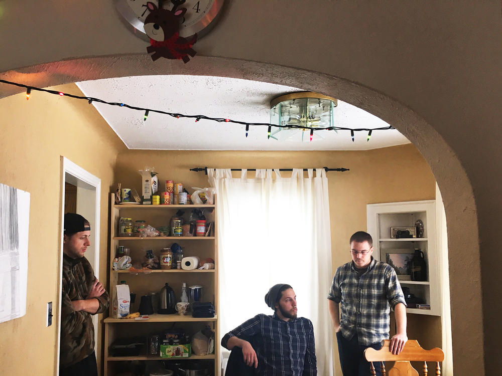 Mohammed al Refai's roommates, Johnny Zellers (left), Andrew Trumbull and Doug Walton in their shared house in 2017.