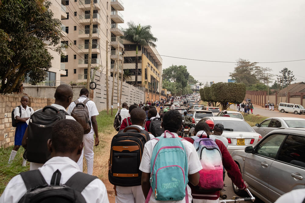 Students return home after a day at Kololo Secondary School. School resumed in Uganda in January after the world's longest pandemic school closure — 22 months.