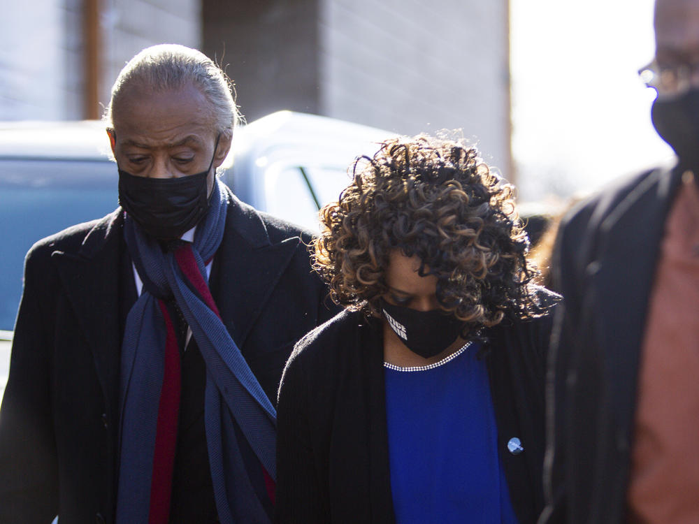 Amir Locke's mother Karen Wells, center, and the Rev. Al Sharpton, left, arrive at the funeral for Locke at Shiloh Temple International Ministries, Thursday, Feb. 17, 2022, in Minneapolis, Minn. Locke was killed Feb. 2 by Minneapolis police as they executed a no-knock search warrant.