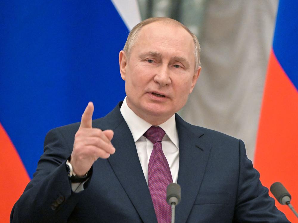 Russian President Vladimir Putin speaks during a joint news conference with Germany's chancellor following their meeting at the Kremlin, in Moscow, on Tuesday. That day the Kremlin said it pulled back some Russian troops but the U.S. and NATO have rejected the claim.