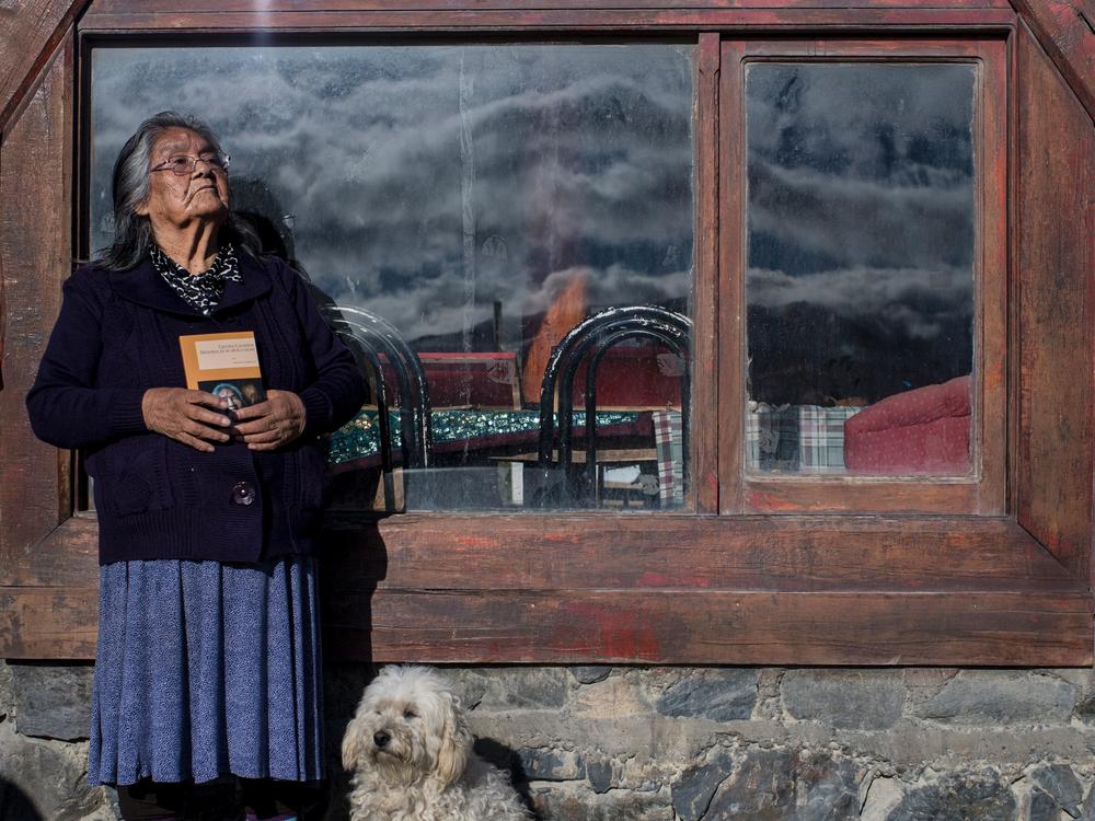 Cristina Calderón, the last known native speaker of the Yaghan language, poses outside of the local community center in Puerto Williams, southern Chile, on April 23, 2017.