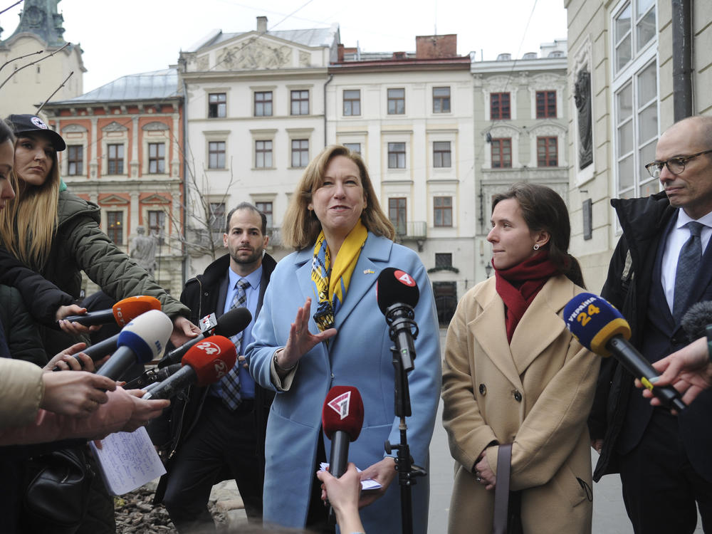 The acting U.S. ambassador to Ukraine, Kristina Kvien, speaks to media in Lviv, Ukraine, on Tuesday. The U.S. has relocated the embassy from the capital Kyiv to the western city of Lviv, citing the buildup of Russian forces on Ukraine's borders. An estimated 20,000 or more Americans have been living in Ukraine. Many have left, but some say they'll remain even if war breaks out.