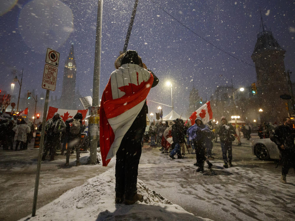 Demonstrators and supporters of the protest movement gather on Thursday in downtown Ottawa.