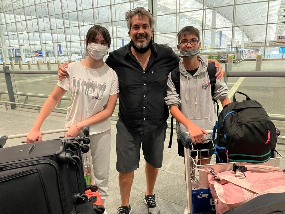 Kevin Tranbarger poses with his two children outside the Hong Kong International Airport in July, before they left for the United States. A few weeks later, Tranbarger decided to permanently move away from Hong after living there for nearly three decades.