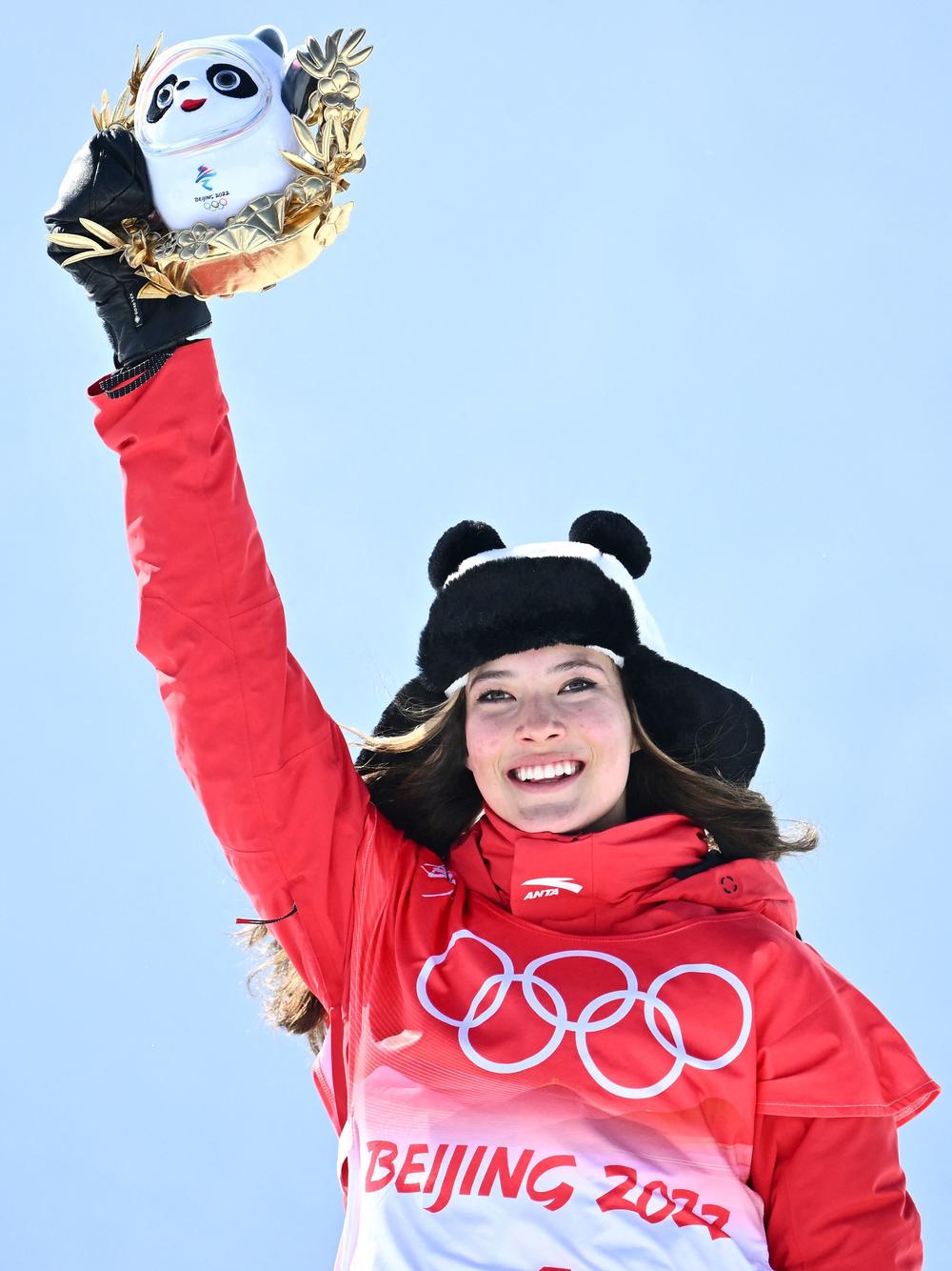 Gold medalist Eileen Gu, competing for China, poses on the podium during the venue ceremony after the freestyle skiing women's freeski halfpipe on Friday.