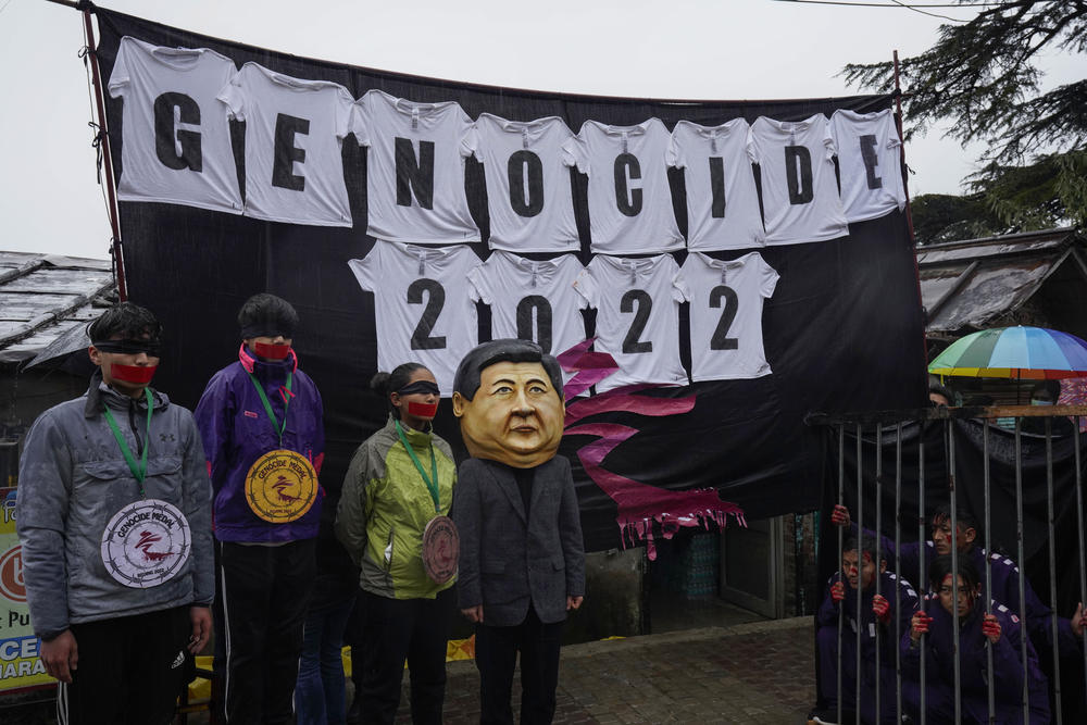 An exiled Tibetan wears a hollow head in the likeness of Chinese President Xi Jinping during a street protest in Dharmsala, India, on Feb. 3 to highlight human rights abuses in China.