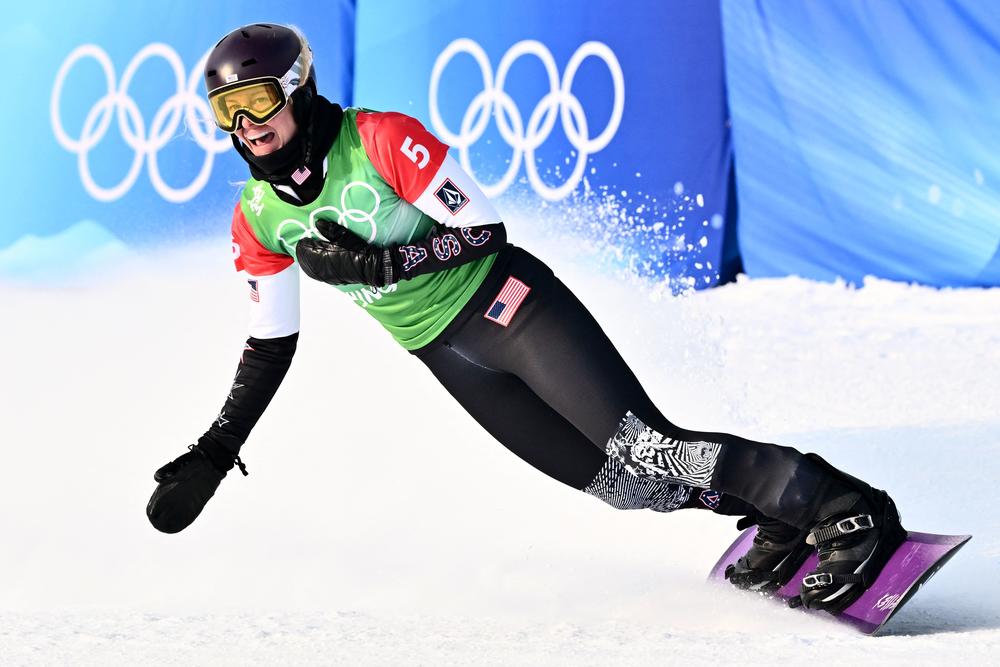 Team USA's Lindsey Jacobellis celebrates her win in the snowboard women's cross final on Feb. 9.