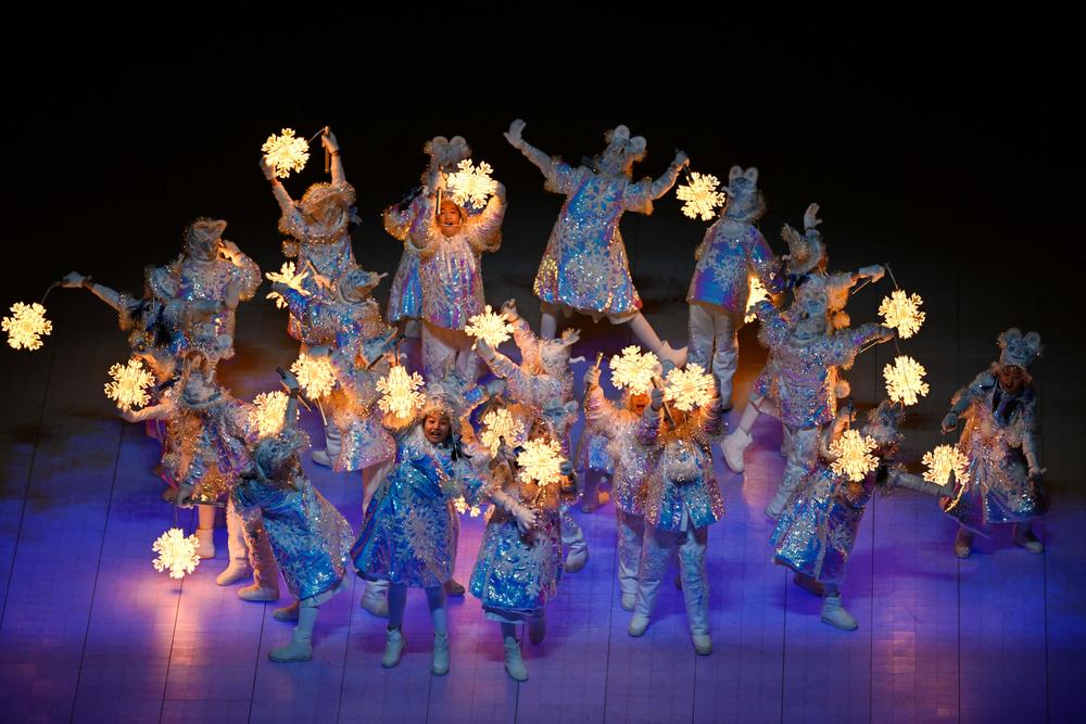 Children carrying snowflake lanterns perform during the closing ceremony of the Beijing 2022 Winter Olympic Games, at the National Stadium, known as the Bird's Nest, in Beijing, on February 20, 2022.