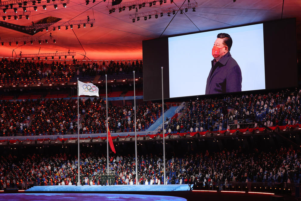 Xi Jinping, President of China is seen on a big screen as the Olympic Flag flies prior to the Beijing 2022 Winter Olympics Closing Ceremony on Day 16 of the Beijing 2022 Winter Olympics at Beijing National Stadium on February 20, 2022 in Beijing, China.