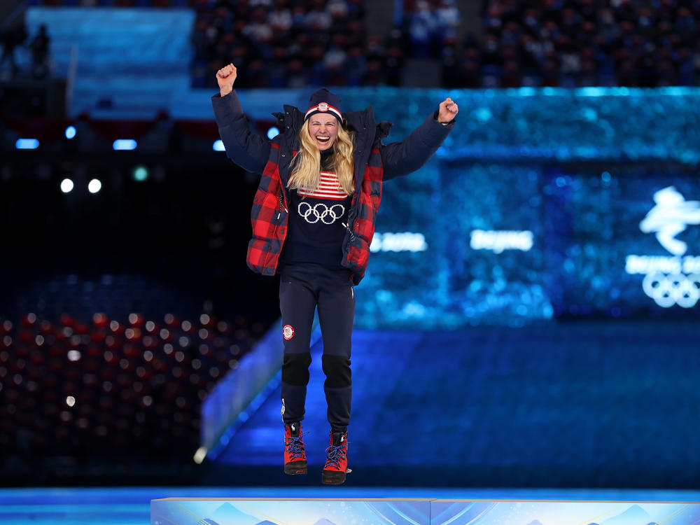 Silver medalist Jessie Diggins of the U.S. celebrates during the Women's 30km Mass Start medal ceremony during the Beijing 2022 Winter Olympics Closing Ceremony.