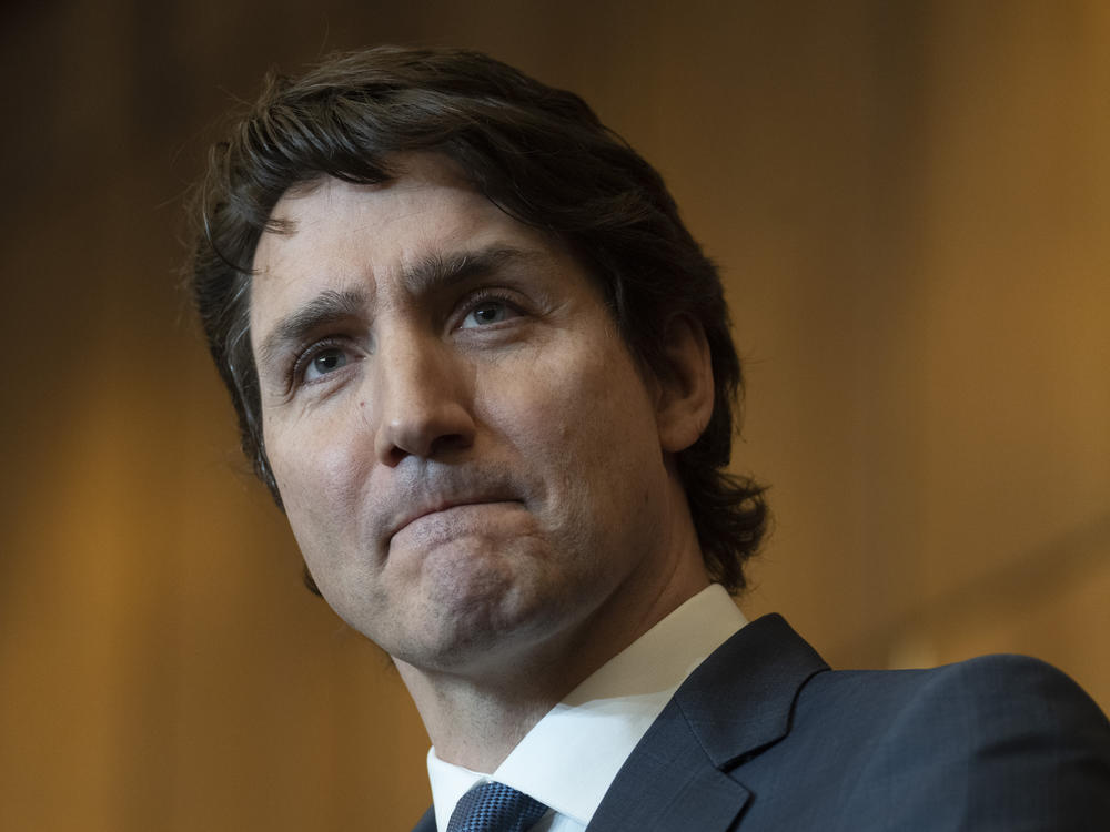 Prime Minister Justin Trudeau listens to a question during a news conference on Monday in Ottawa. Trudeau said emergency powers are still needed despite police ending border blockades and the occupation of the nation's capital by truckers and others angry over Canada's COVID-19 restrictions.