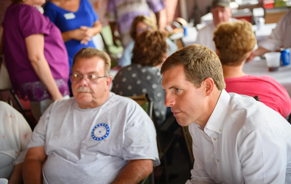 Rep. Conor Lamb, D-Pa., talks with constituents at Riardo's Bar and Grill in New Castle, Pa., last summer.