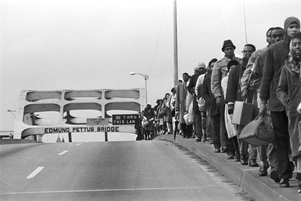 The Selma to Montgomery March progresses over the Edmund Pettus Bridge, where marchers were later attacked in an event known as Bloody Sunday, on March 7, 1965.