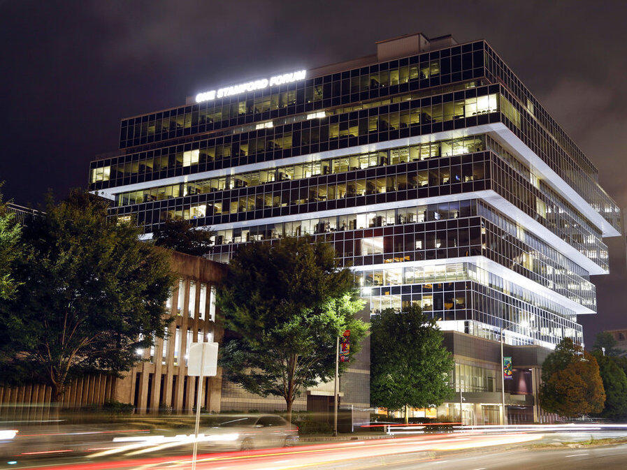 Cars pass Purdue Pharma headquarters in Stamford, Conn., in 2019.