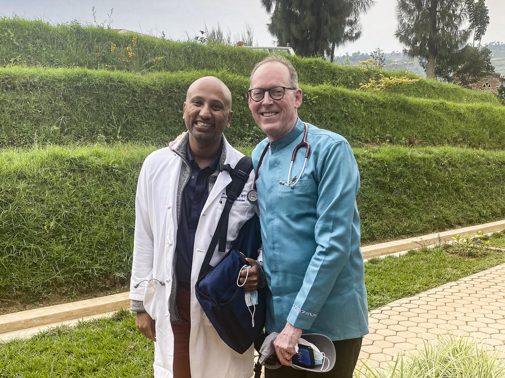 Dr. Paul Farmer (right) and Dr. Sriram Shamasunder on the Butaro hospital campus in Rwanda on Feb. 17. Farmer died on Feb. 21.