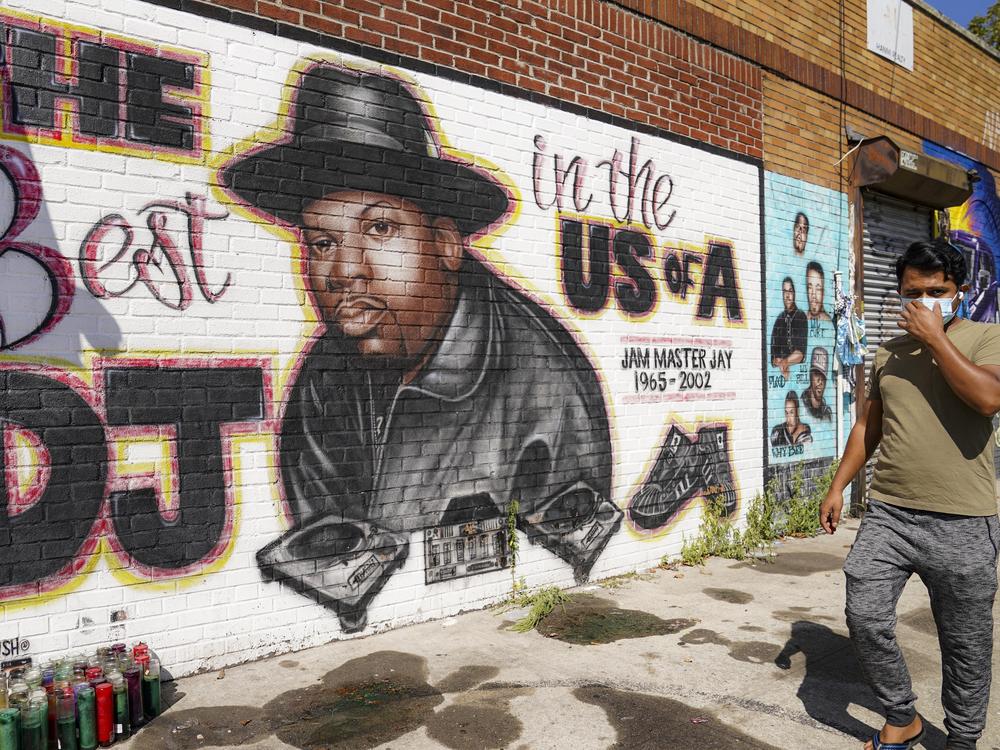 A pedestrian passes a mural of rap pioneer Jam Master Jay of Run-DMC in 2020 in Queens. A man charged in the slaying of Run-DMC legend once filmed a brazen rap video in front of the mural, prosecutors say in court papers opposing the defendant's release on bail.