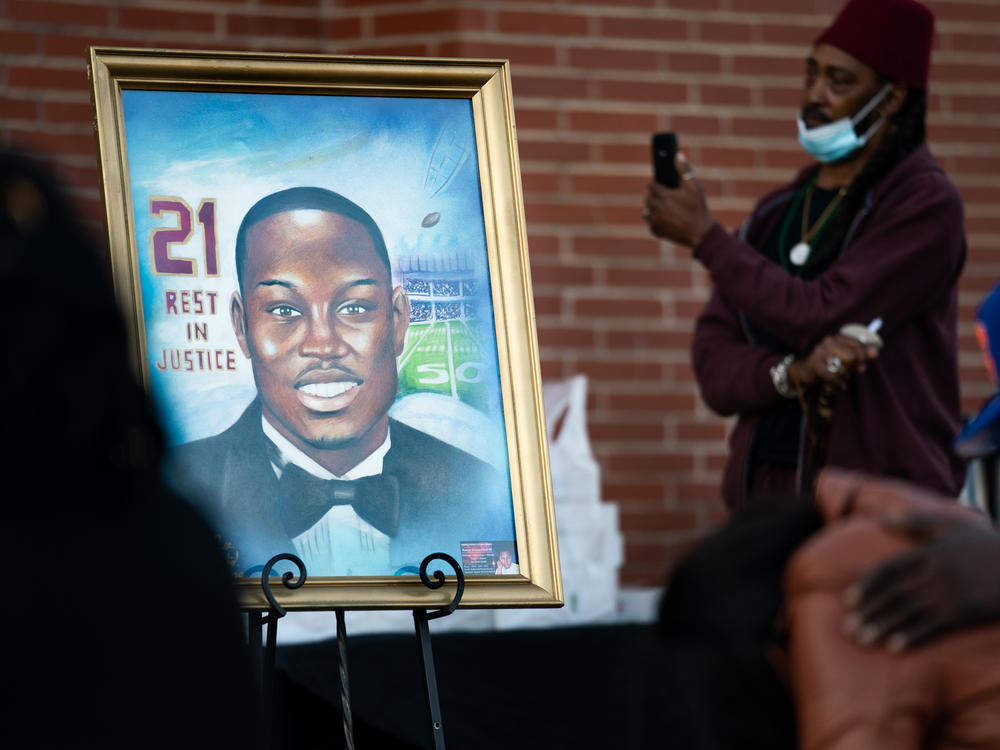 A painting of Ahmaud Arbery is displayed during a vigil at New Springfield Baptist Church on Wednesday in Waynesboro, Ga.