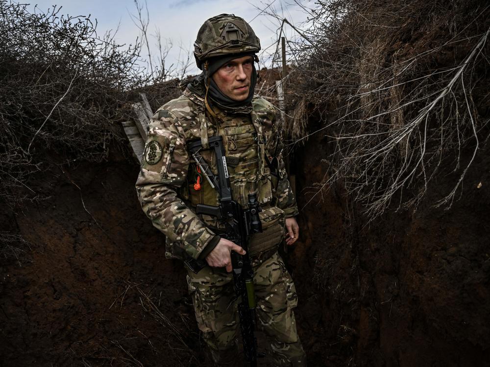 Ukrainian troops patrol at the frontline outside the town of Novoluhanske, in eastern Ukraine, on Feb. 19.