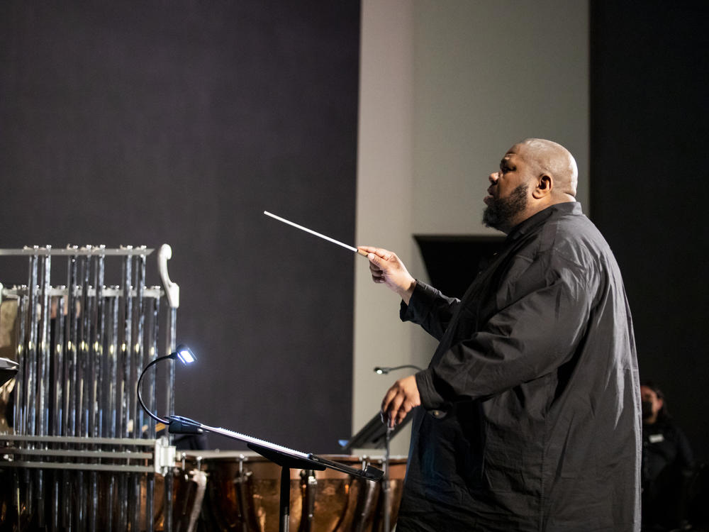 Composer, conductor and multi-instrumentalist Tyshawn Sorey leads a rehearsal of his <em>Monochromatic Light (Afterlife) </em>at the Rothko Chapel in Houston on Feb. 18.