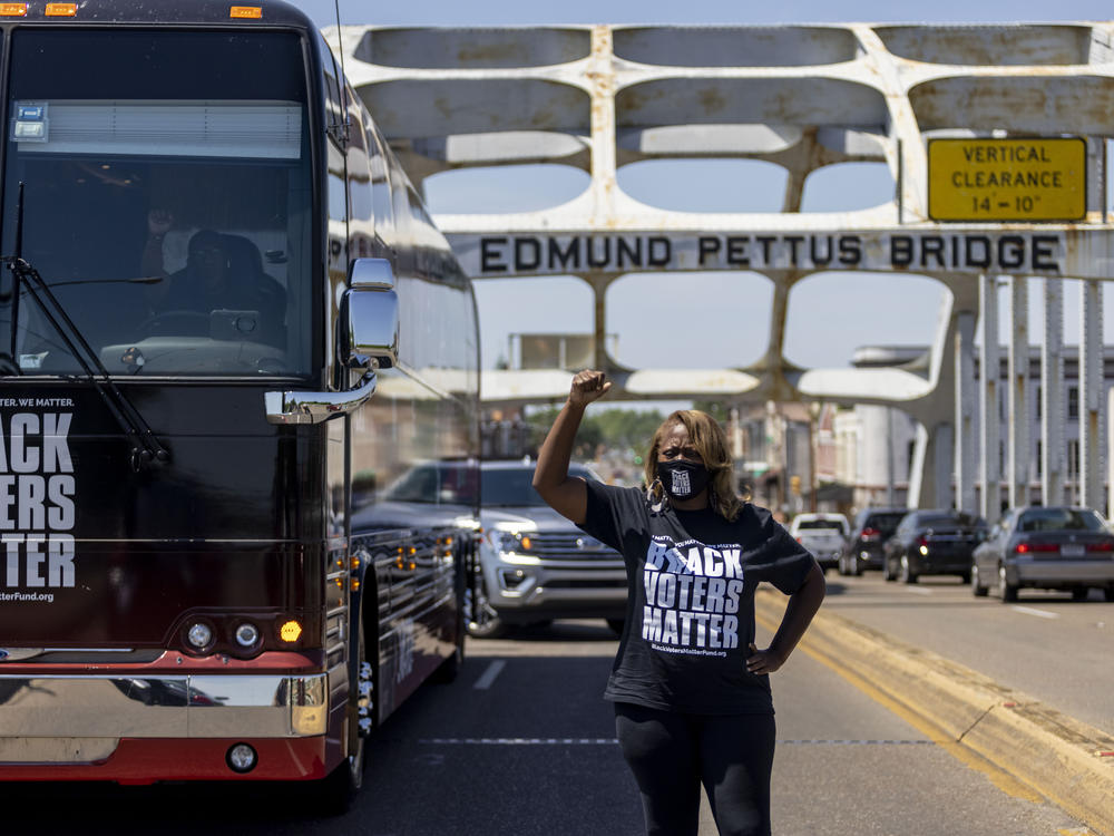 LaTosha Brown, co-founder of Black Voters Matter, stands atop the Edmund Pettus Bridge, a famous civil rights landmark, on May 8, 2021, in Selma, Ala.