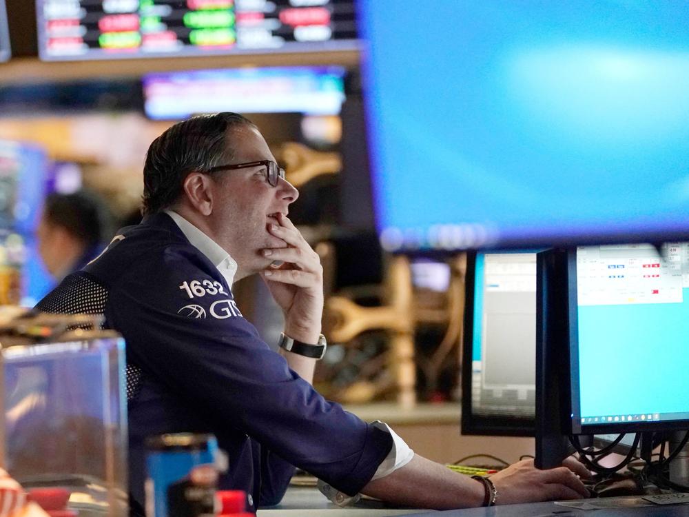 Traders work on the floor of the New York Stock Exchange at the opening bell on Tuesday in New York. Stocks tumbled on Thursday after Russia invaded Ukraine, sending the Nasdaq into what's known as a bear market.