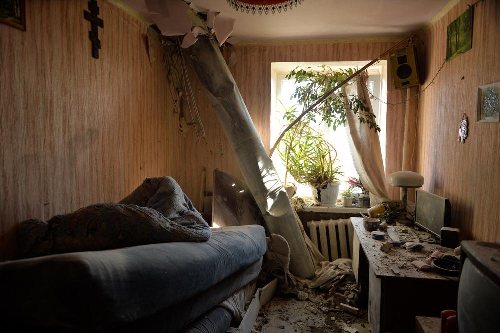 The body of a rocket is stuck in a flat after shelling on the northern outskirts of the Ukrainian city of Kharkiv on Feb. 24. Russian President Vladimir Putin launched a full-scale invasion of Ukraine on Feb. 24, forcing residents to flee for their lives and leaving at least 40 Ukrainian soldiers and 10 civilians dead.
