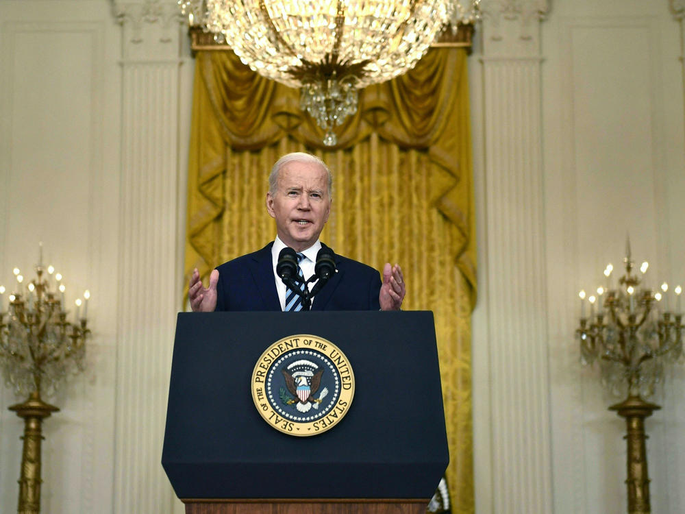 President Biden announces new sanctions against Russia after its invasion of Ukraine in the East Room of the White House on Thursday.