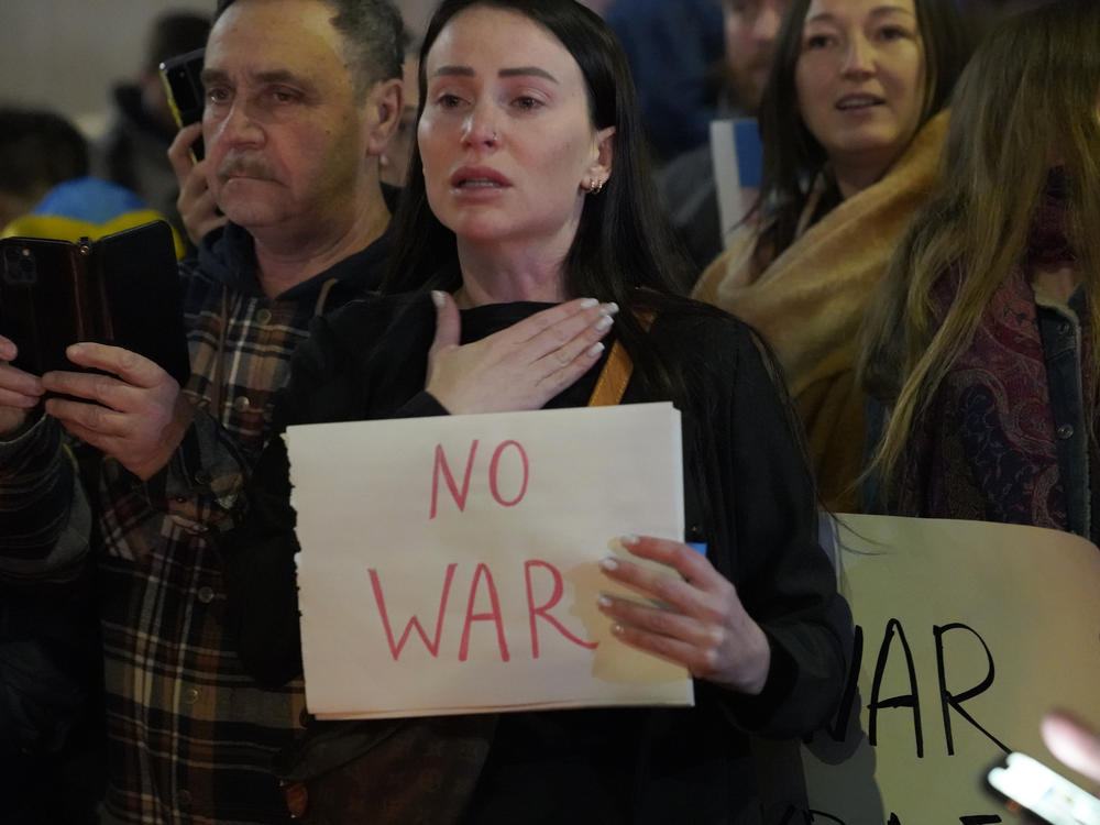 People protest the Russian invasion of Ukraine at a demonstration in the Studio City neighborhood of Los Angeles on Thursday.