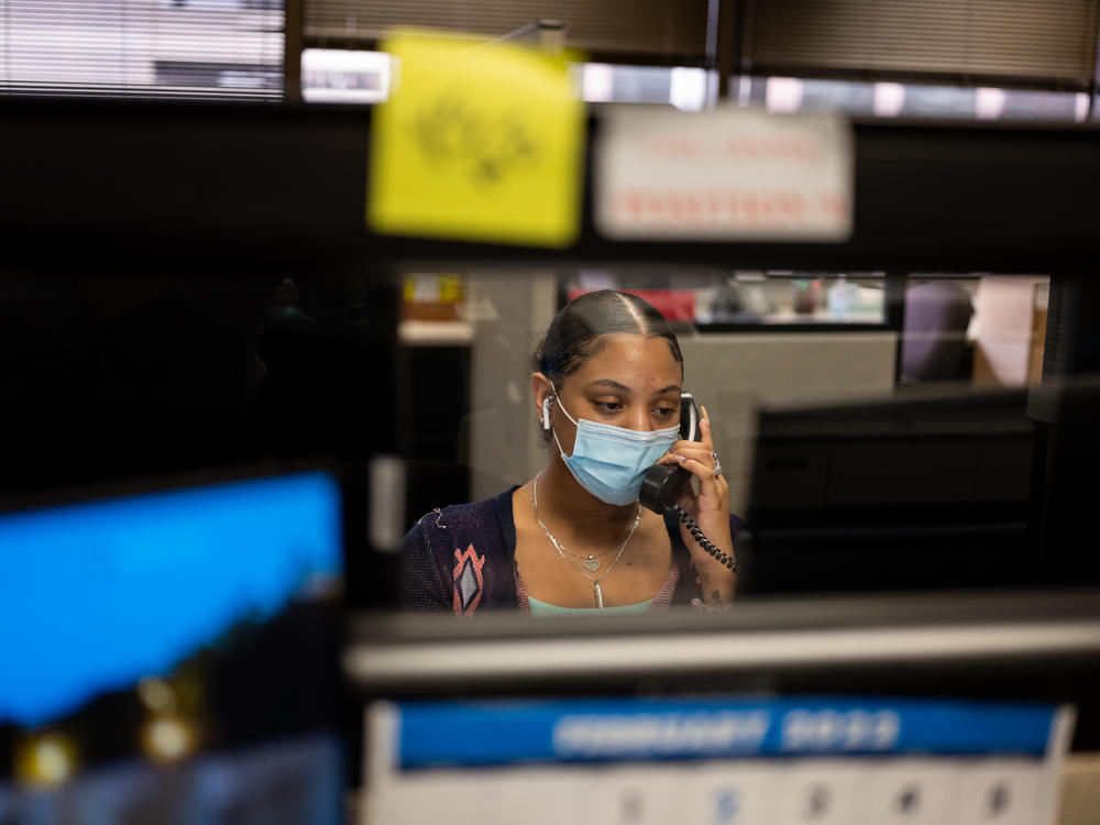 Destiny Laurence receives a call at the Harris County Election Office in downtown Houston. In January alone, Laurence and the 14 other workers in the call center received 8,000 calls from people asking for help navigating the voting process.