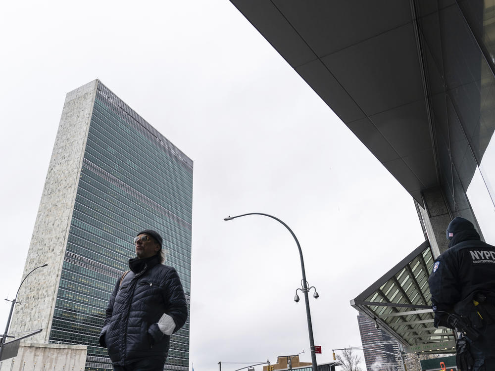 A pedestrian walks past U.N. headquarters Friday in New York.