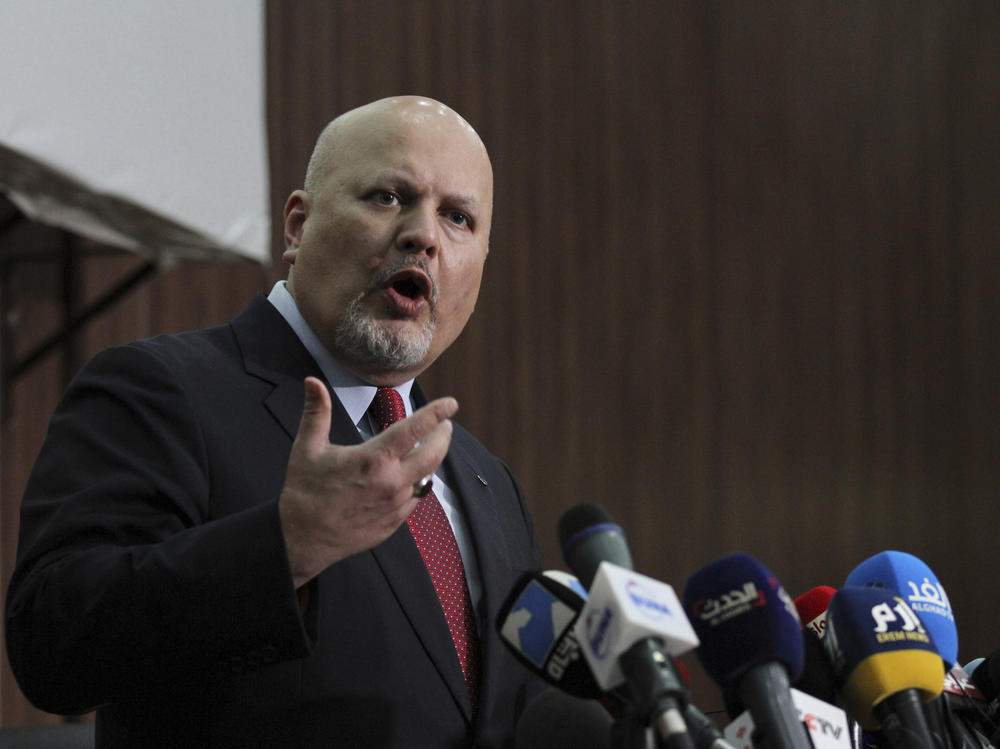 Karim A.A. Khan, the International Criminal Court's chief prosecutor, speaks during a news conference last August. The prosecutor has put combatants and their commanders on notice that he is monitoring Russia's invasion of Ukraine and has jurisdiction to prosecute war crimes and crimes against humanity.