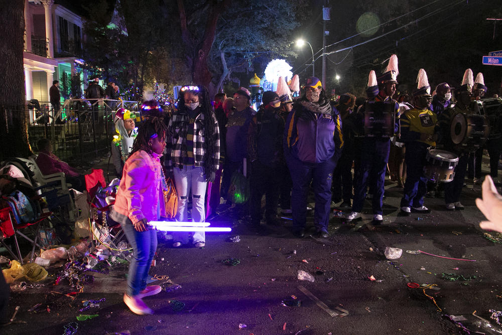 Children in the crowd along the three and half mile route grasped light-up and invisible drum sticks and played along to the beat.