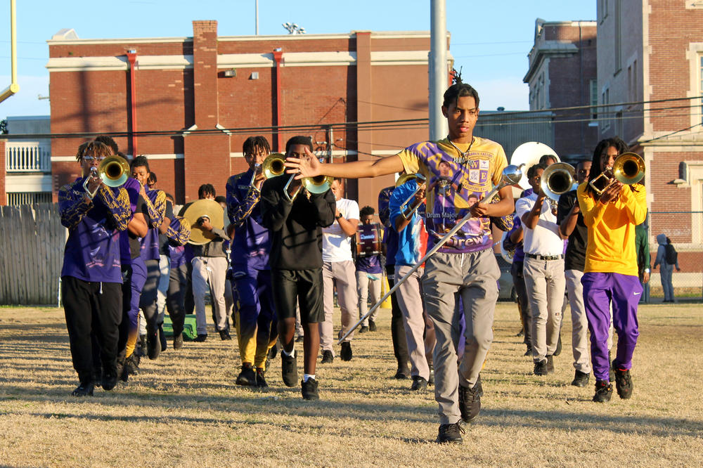 Drew Crosby, the drum major at Warren Easton, says that when the crowd is feeling good, he does, too.