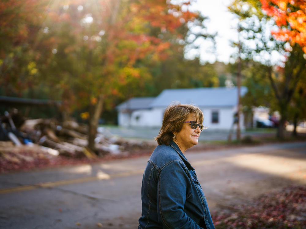 Gretchen Turner looks toward her home before making her way to Halloween festivities in downtown Waverly, Tenn.