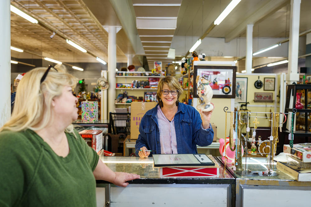 Gretchen Turner (right) laughs with Vintage Treasures owner Beth Leening. Gretchen has two booths of sale items at Vintage Treasures.