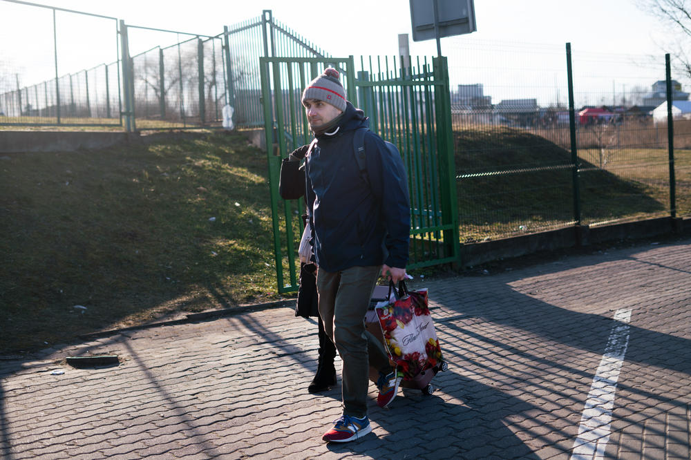 Sergei Smushko, who is Russian, helps a woman return to Ukraine to get her children. 