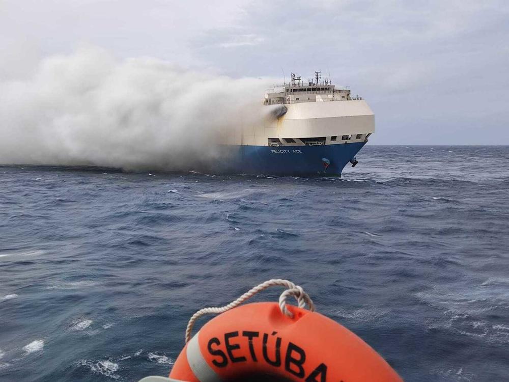 Smoke billows from the burning Felicity Ace car-transport ship as seen from a Portuguese navy vessel southeast of the mid-Atlantic Portuguese Azores islands. The large cargo vessel carrying cars from Germany to the U.S. sank in the mid-Atlantic 13 days after a fire broke out on board.