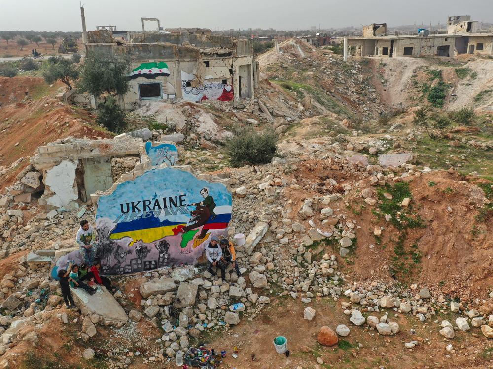 As Russian forces began their invasion of Ukraine last week, artists in the Syrian city of Binnish painted a mural to show solidarity with Ukraine. It was painted on what's left of a home destroyed by Russian aircraft during Syria's civil war.