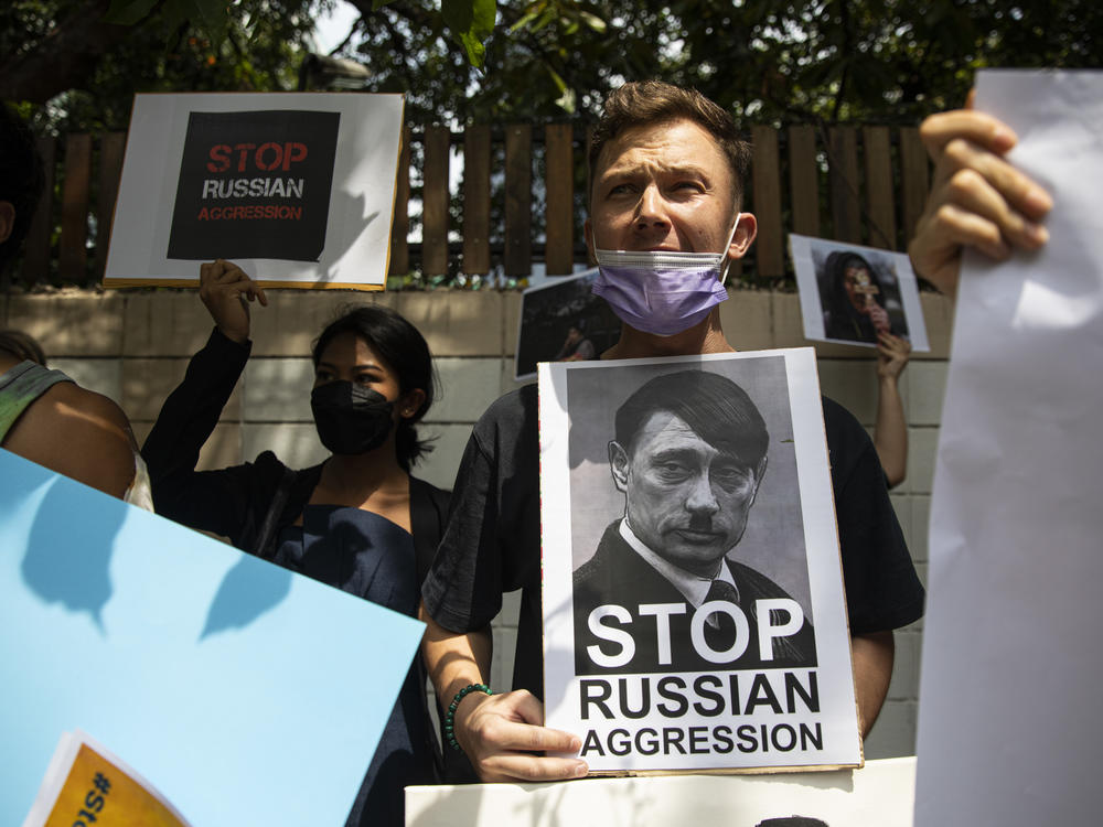 Protesters rallied outside the Russian Embassy in Bangkok, Thailand on Friday, after Russian forces invaded Ukraine.