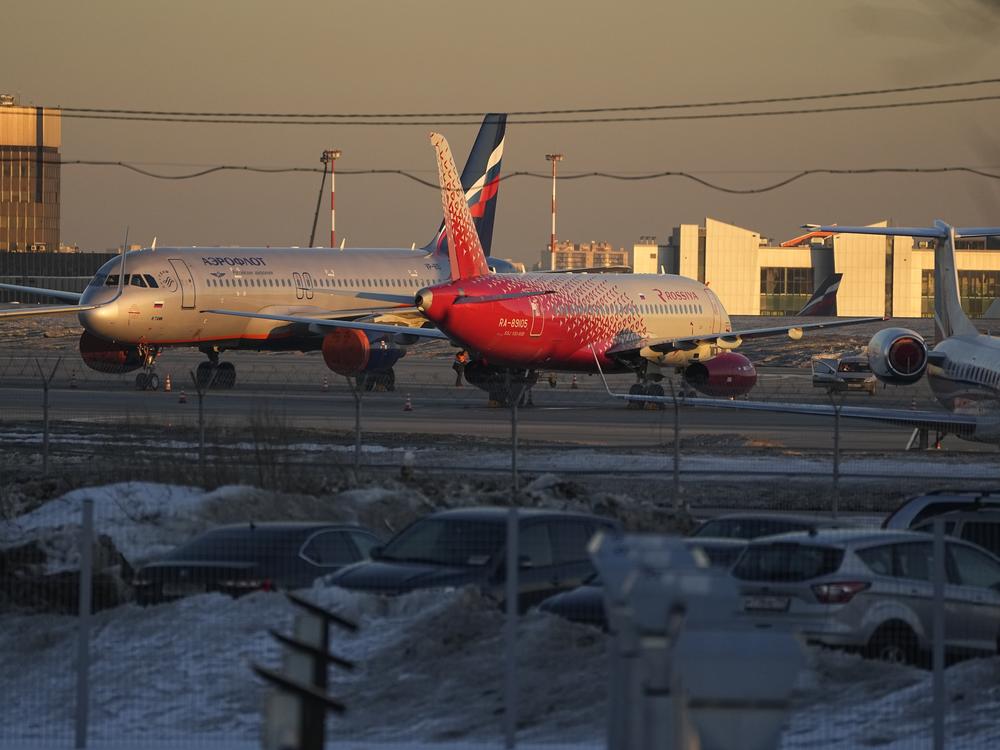 Aeroflot passengers planes are seen parked at Sheremetyevo Airport, outside Moscow, on  Tuesday. Russia's largest airline, Aeroflot, said Monday that it suspended flights to New York, Washington, Miami and Los Angeles because Canada had closed its airspace to Russian planes.