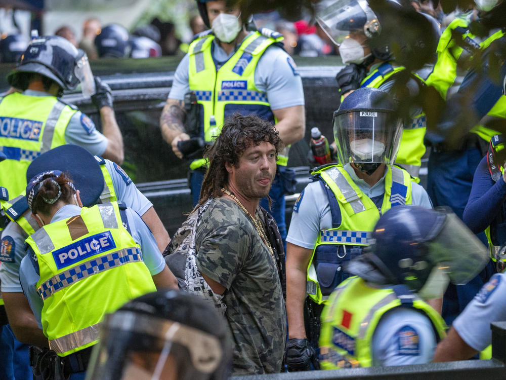 A demonstrator is arrested at a protest opposing coronavirus vaccine mandates in Wellington, New Zealand, on Wednesday.