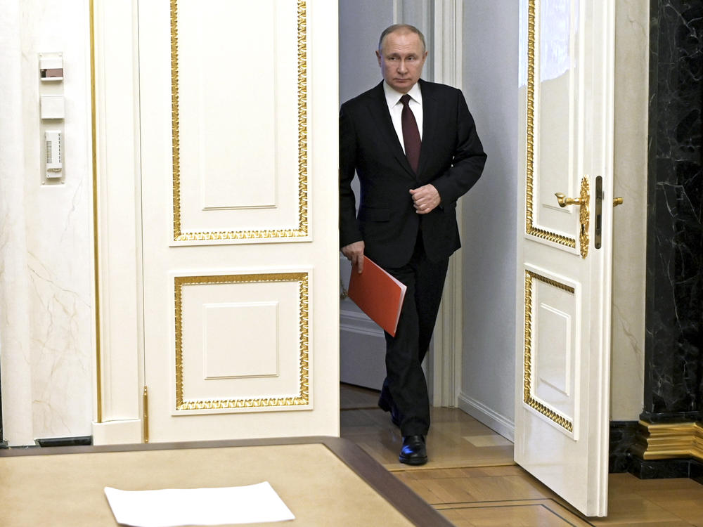 Russian President Vladimir Putin enters a hall to chair a Security Council meeting in Moscow on Feb. 25.