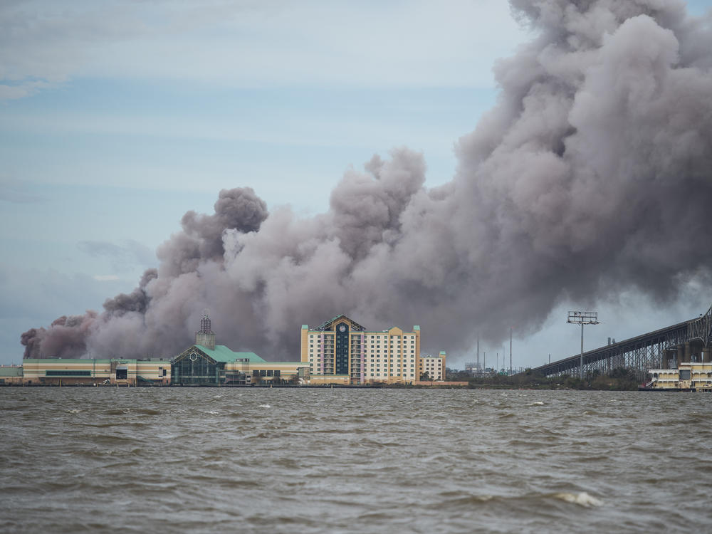 A chemical plant near Lake Charles, La., burns after sustaining damage from Hurricane Laura in August 2020. A new analysis finds about one third of hazardous chemical facilities in the United States are at risk from climate-driven extreme weather.