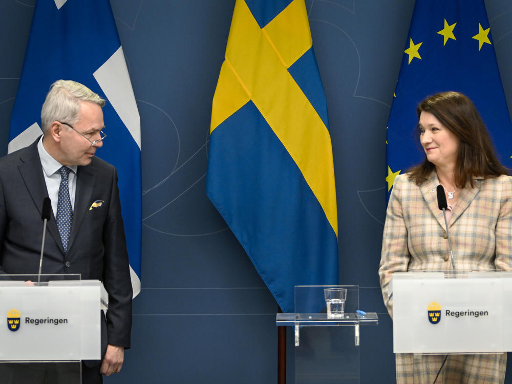 Finnish Foreign Minister Pekka Haavisto, left, and his Swedish counterpart Ann Linde, take part in a joint news conference in Stockholm on Feb. 2, 2022, after talks on European security.