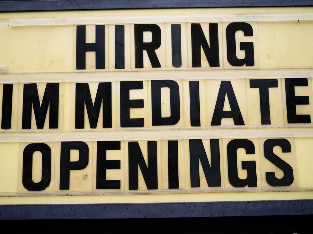 A hiring sign is posted outside a business in Huntingdon Valley, Pa., on Feb. 22. Employers are keen for workers as the economy continues to recover from the pandemic.