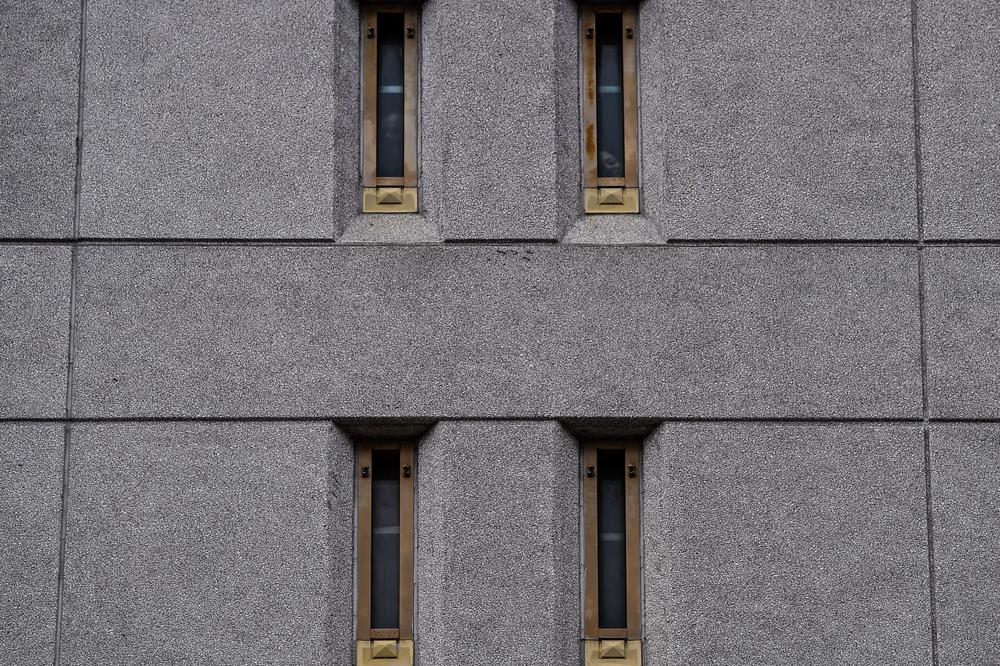 Prisoners look out of their windows at the federal detention center in downtown Miami on June 12, 2020.