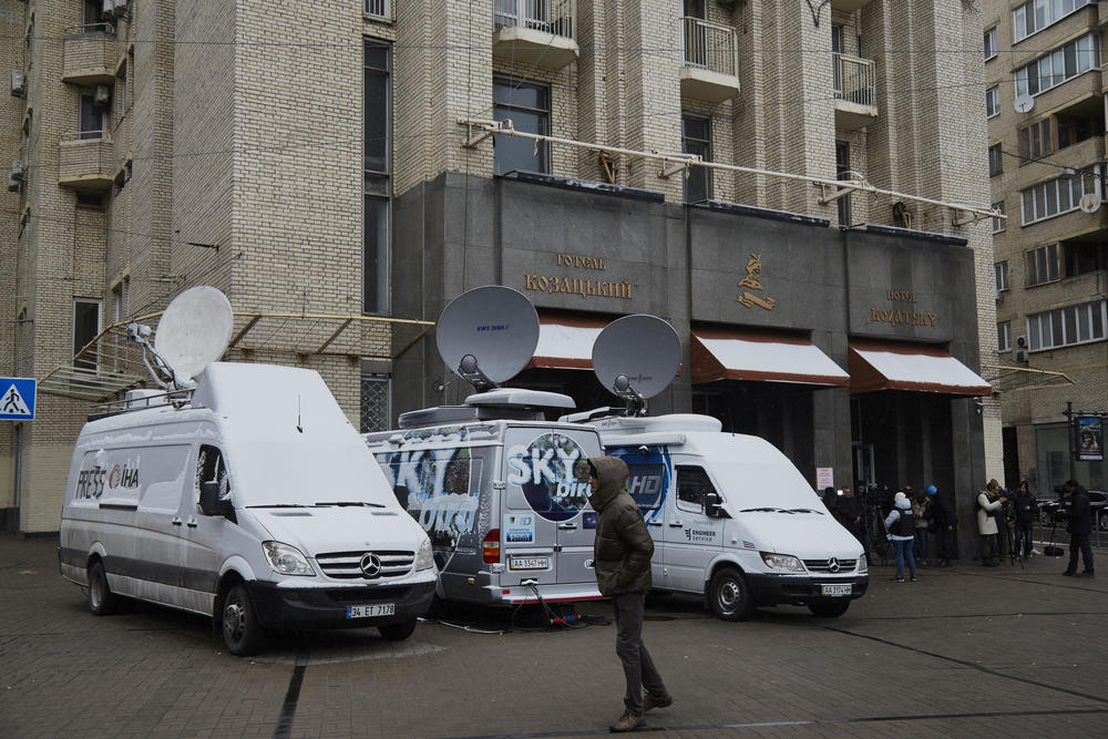 Media broadcasting vans parked in front of a hotel at Independence Square in Kyiv, Ukraine, on March 1.