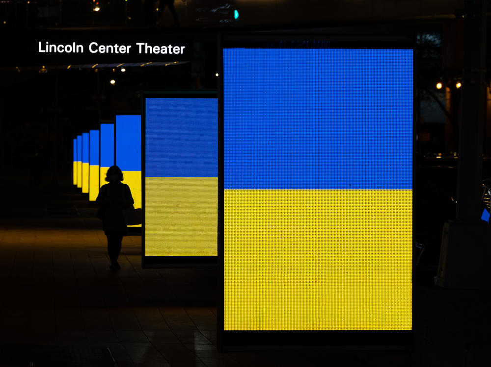 The colors of the Ukrainian flag are displayed on the 65th Street sidewalk outside Lincoln Center in New York City.