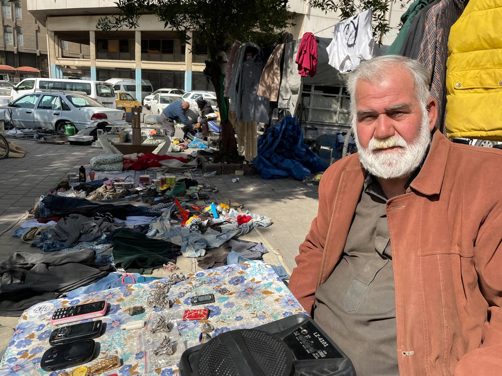 Basim Mohamed Darweesh, a Baghdad street vendor, has several old watches, some cell phones and a pile of jewelry on a folding table. He says he can no longer work at the market past noon most days even in the cooler winter months: 
