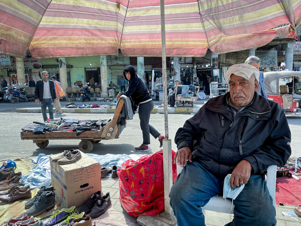 Razak Abdul-Zahra Mubarak, 70, sells used shoes on the street in al Maidan Square in Baghdad. 